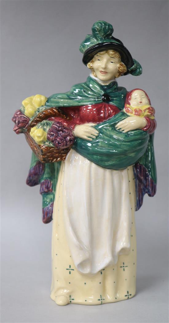 A Royal Doulton group, The Flower Seller HN789 height 21cm